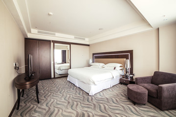 photo of interior design of luxury hotel bedroom