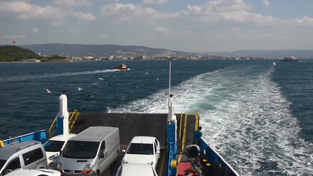 A car ferry arrives at the shore. Water transport