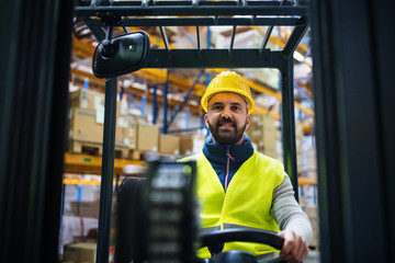 Warehouse man worker with forklift.