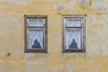 Fototapeta na wymiar old open window at an abandoned house