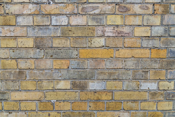 brick wall background in yellow colors