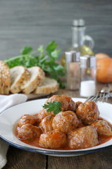 Stewed meatballs with tomato sauce in a plate