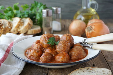 Stewed meatballs with tomato sauce in a plate