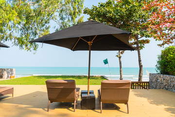 Umbrella and chair neary sea and beach