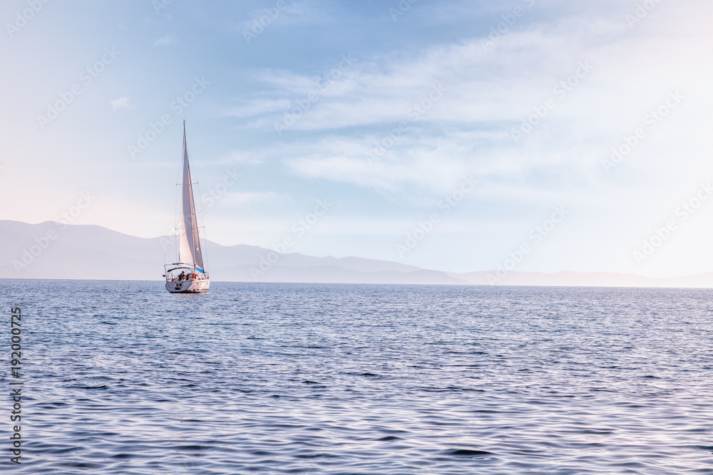 Wall mural sailing yacht in mediterranean sea at sunset. travel and active lifestyle concept