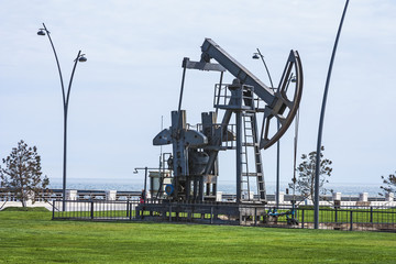 Oil pump pumping oil in former oil fields. Equipment of the oil industry. Baku, Azerbaijan,