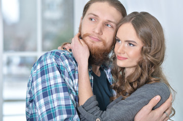 Obraz na płótnie Canvas Beautiful young couple hugging