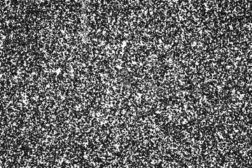 Black paint grain on white paper background.