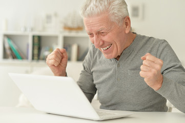 senior man using laptop 