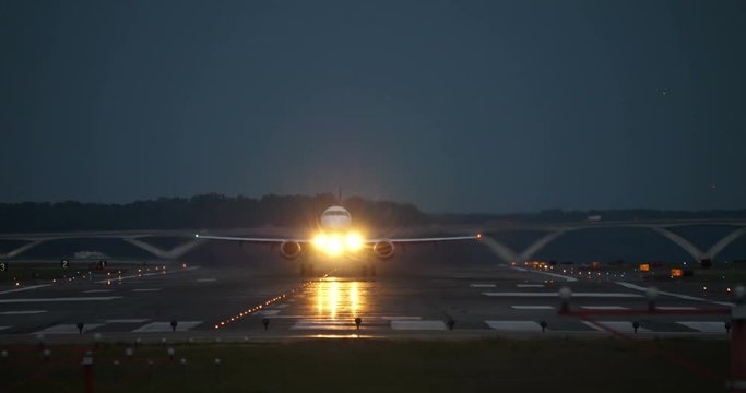 Airplane Taking off Reagan National Airport at Dusk Bright Lights