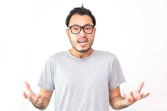 Closeup portrait of angry asian man screaming, isolated on white background with copy space