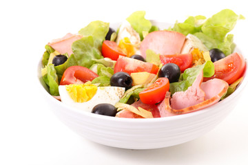 salad with tomato, ham, egg and olive