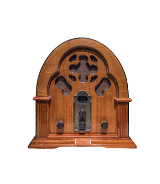 Vintage wood radio from 1930 isolated with a white background.Antique model cathedral.