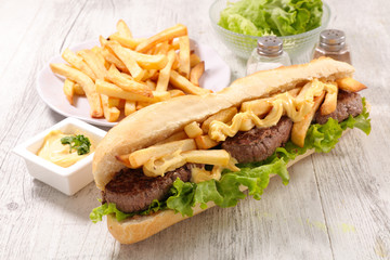 sandwich with beef, salad and french fries
