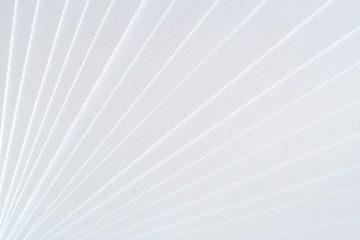 Fototapeta White geometric pattern of clean paper sheets, spaced as fan. obraz