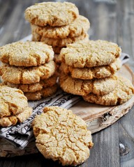 Stacks of homemade honey biscuits with cracks added with coconut