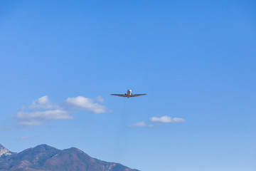 Fototapeta na wymiar Take off the aircraft from the airfield Tivat flying over me. Montenegro. 