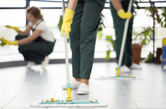 Person Cleaning The Floor