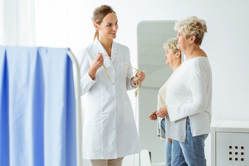 Fototapeta premium Doctor with measure tape