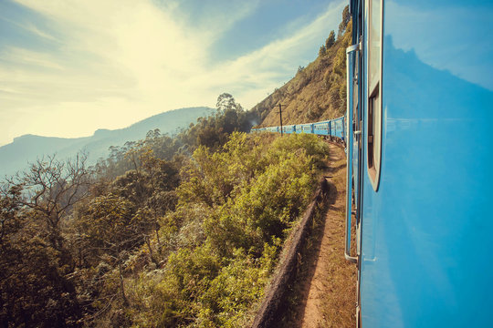 Great view with speed going train over the green hills of Sri Lanka