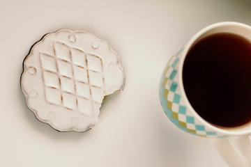 Mug with tea and cookies