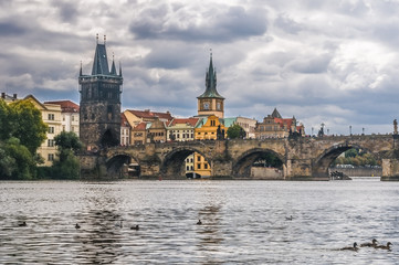 Fototapeta na wymiar Charles Bridge is a historical landmark of Prague on the Vltava River