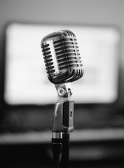 Retro microphone in home studio. Black and white.