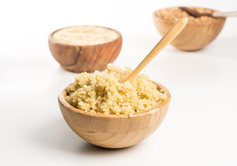 Wooden Bowl full of quinoa.