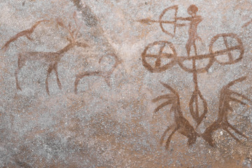 A hunting scene on the wall of the cave. ancient hunters. archeology. era. stone Age.