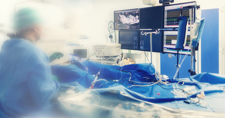 Cardiologist doing catheter ablation with radiofrequency energy using imaging system with fluoroscopic X-ray tube for interventional vascular procedures and electrophysiology. image guided system - obrazy, fototapety, plakaty