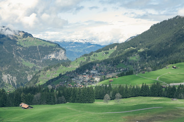 Fototapeta na wymiar The railway and village near biggest glacier of jungfrau. Bernese Oberland, Switzerland. Swiss Alps