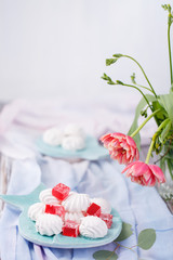 marshmallows and red marmalade in a blue plate