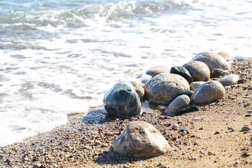 Fototapeta na wymiar Stones on a beach near the sea