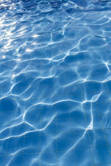 Surface of swimming pool water background