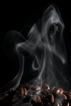 Coffee beans smoking after a fresh roasting.