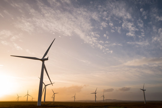 Wind turbines at sunset