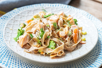 Pasta with salmon in a creamy sauce