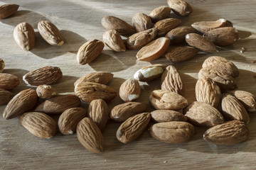 Almonds on wooden table