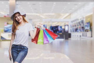 Concept of woman shopping and holding bags.