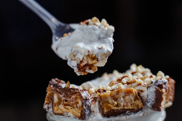 creamy ice cream with chunks of chocolate and nuts