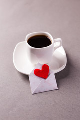 a cup of espresso on a saucer and a love message on Valentine's Day, a declaration of love.