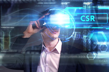 Business, Technology, Internet and network concept. Young businessman working on a virtual screen of the future and sees the inscription: CSR