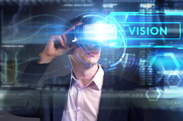 Business, Technology, Internet and network concept. Young businessman working on a virtual screen of the future and sees the inscription: Vision