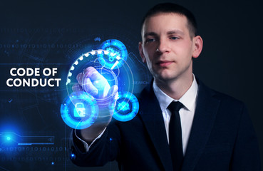 Business, Technology, Internet and network concept. Young businessman working on a virtual screen of the future and sees the inscription: Code of conduct