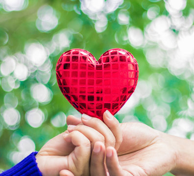 hand holding heart sign