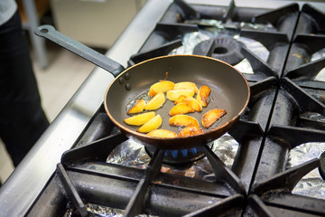 Frying pan with potato wedges