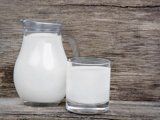 Milk in glassware on rustic table
