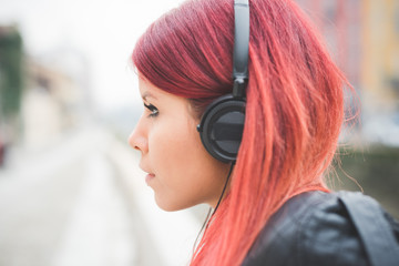 young beautiful red hair venezuelan woman lifestyle listening music