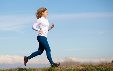Fototapeta premium running woman in country environment