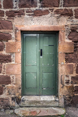 Wooden door entrance at old house at Edinburgh, UK.